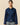 A Rowing Blazers Women’s Fitted Lace Collar Button Down Shirt in navy blue with thin green vertical stripes and an oversized, embroidered scalloped collar.
