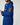 Bright blue Rowing Blazers x Paddington™ Paddington Duffel Coat with a hood, toggle closures, and a sleeve patch featuring an illustration of Paddington Bear.