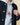 Men’s Babar and Santa Hoodie Heather Gray worn under a dark blue quilted jacket.