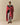 A man wrapped in a cozy red and white Sheep Sherpa Throw Blanket Diana Red with a sheep motif.