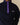 Navy blue Clark Sherpa Navy pullover by Rowing Blazers featuring a purple snap-button placket, zippered side pockets, and an embroidered brand logo on the chest.