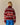 Back view of a red and white Jamie Cropped Button Snap Sheep Sherpa Red featuring a patterned design with rows of small sheep.