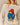 Penelope Paddington Cashmere Sweater Ivory featuring an intarsia-knit bear in a red hat and blue coat holding a jar labeled Marmalade.