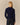 Back view of a Penelope Paddington Cashmere Sweater Navy in a fitted silhouette, featuring a navy blue knit with ribbed cuffs and hem.