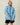 A blue Warm & Wonderful Sheep Sherpa Jacket featuring a zip-up front and a repeating pattern of white sheep.